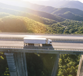 trucks-highway-mountain-sunset